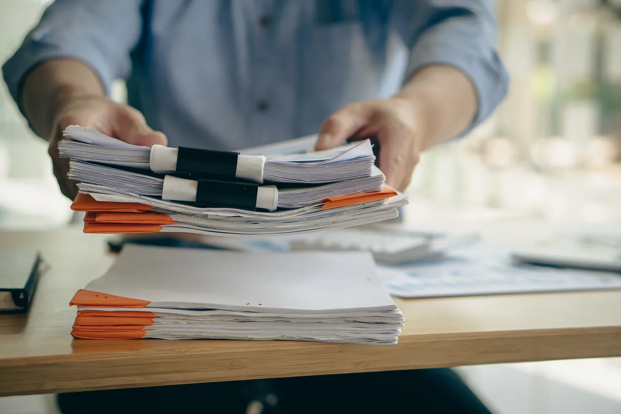 Compliance frameworks documents on an office desk