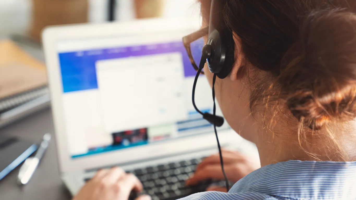 IT helpdesk support technician assisting staff at a Sydney business