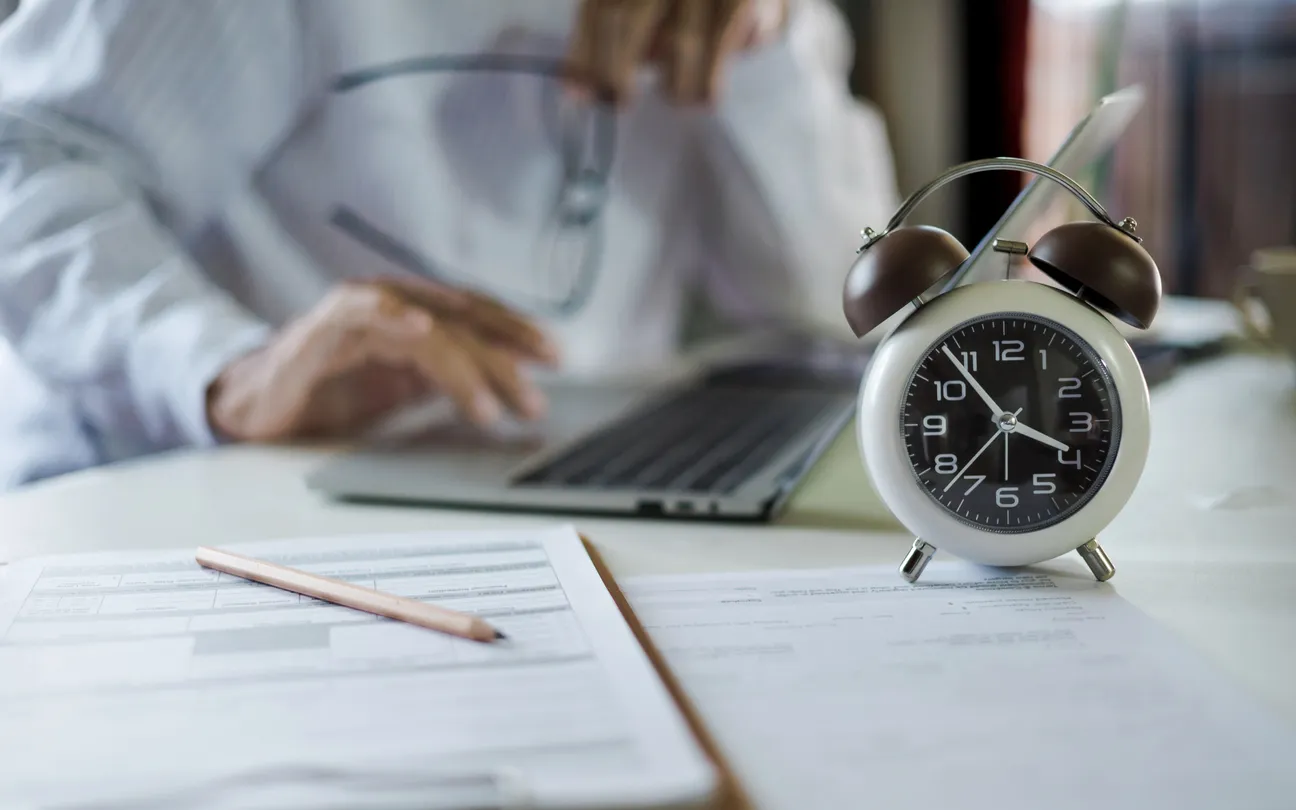 IT service level agreement document with a stopwatch on a Sydney office desk