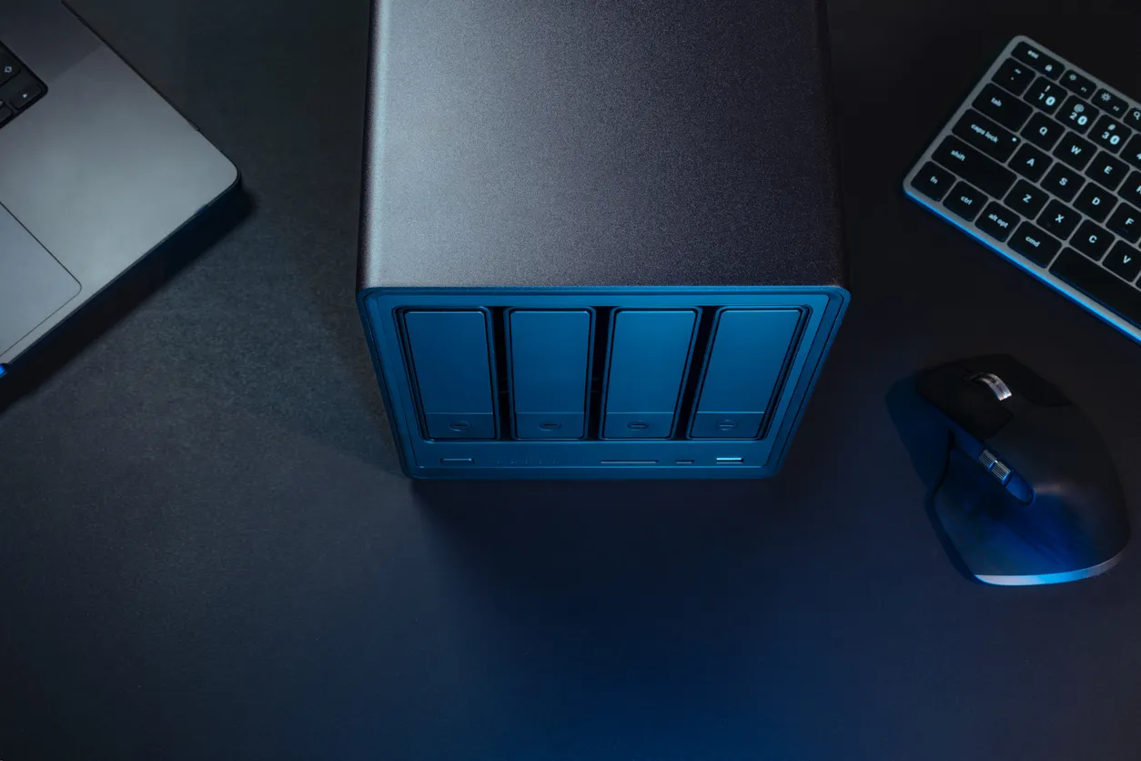 Office server and laptop during a Microsoft 365 data migration in a Sydney business