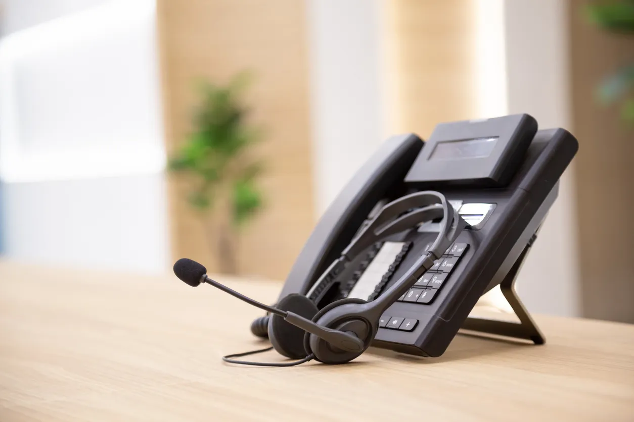 Teams-certified desk phone and headset on a Sydney office desk
