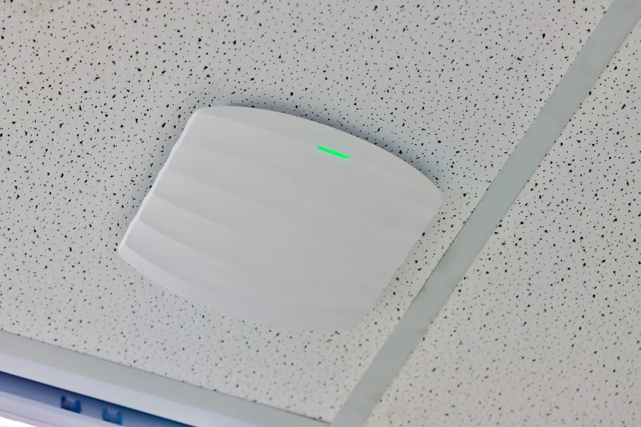 Laptop showing a weak Wi-Fi signal on a desk in a Sydney office