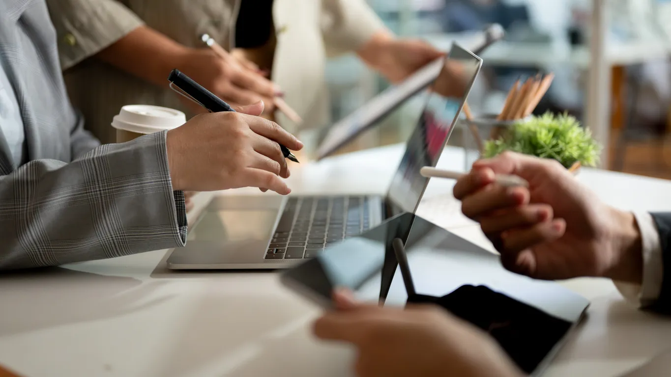 Laptop on a Sydney office desk showing a team collaboration workspace