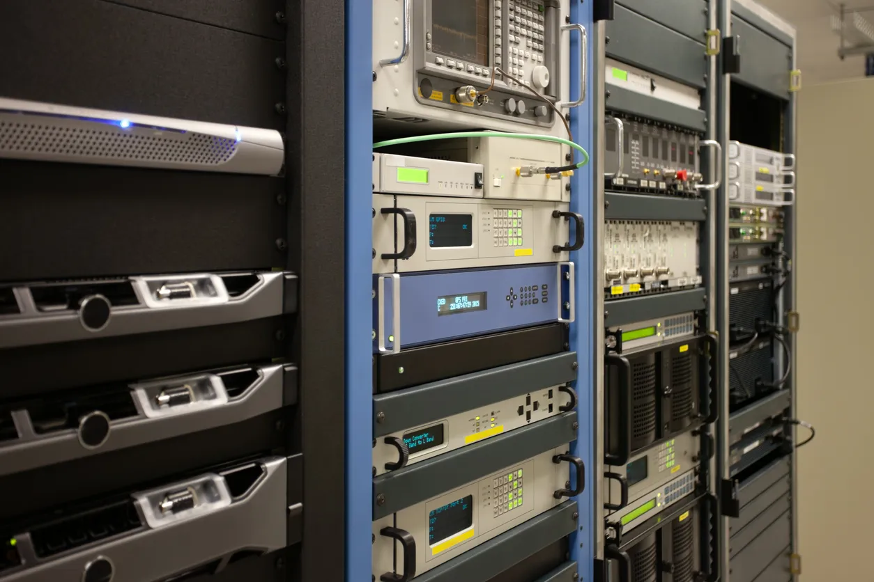 Business firewall appliance mounted in a network rack with patch cabling, managed remotely.
