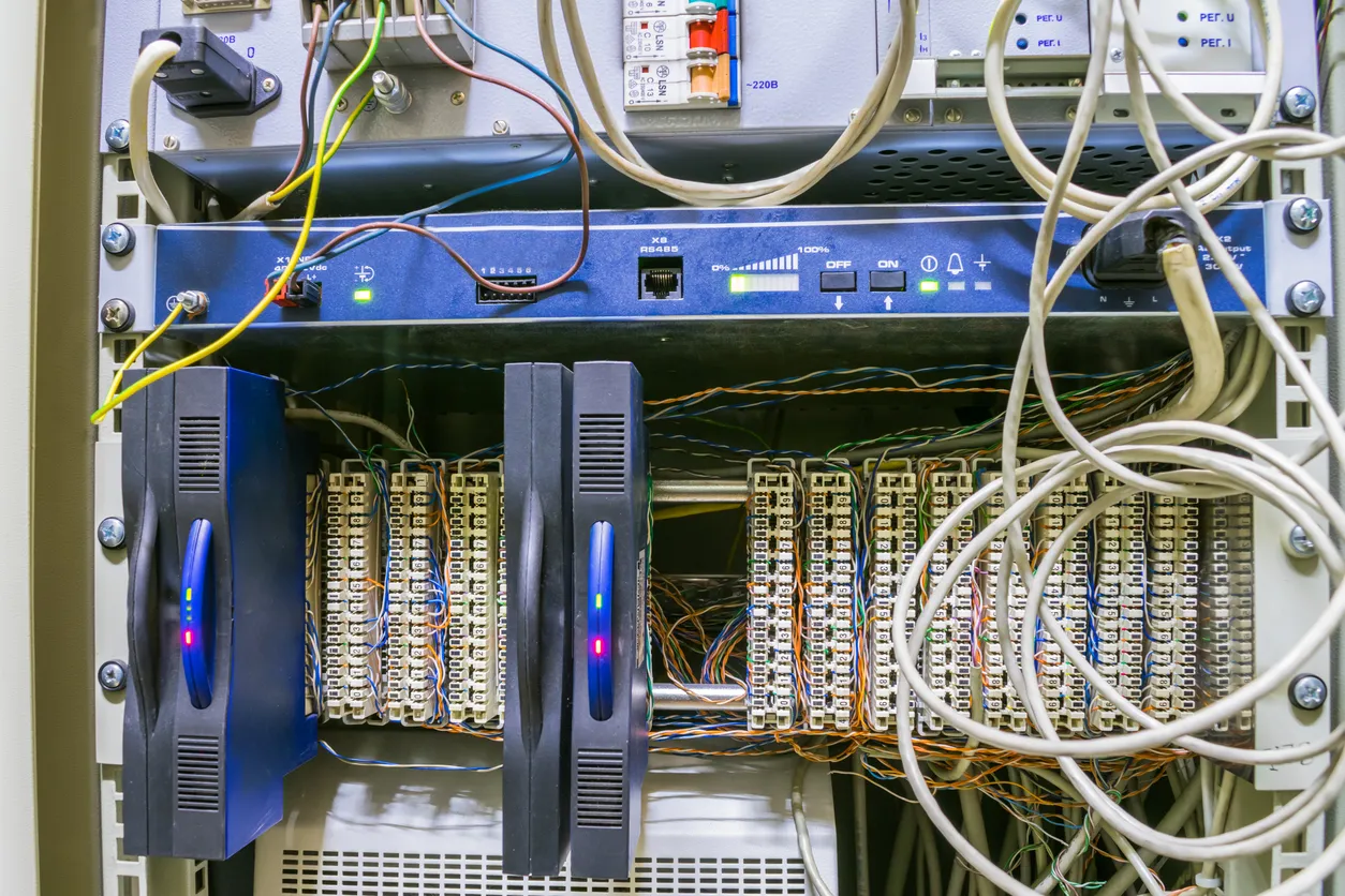 Ageing business firewall appliance in a network rack due for replacement.