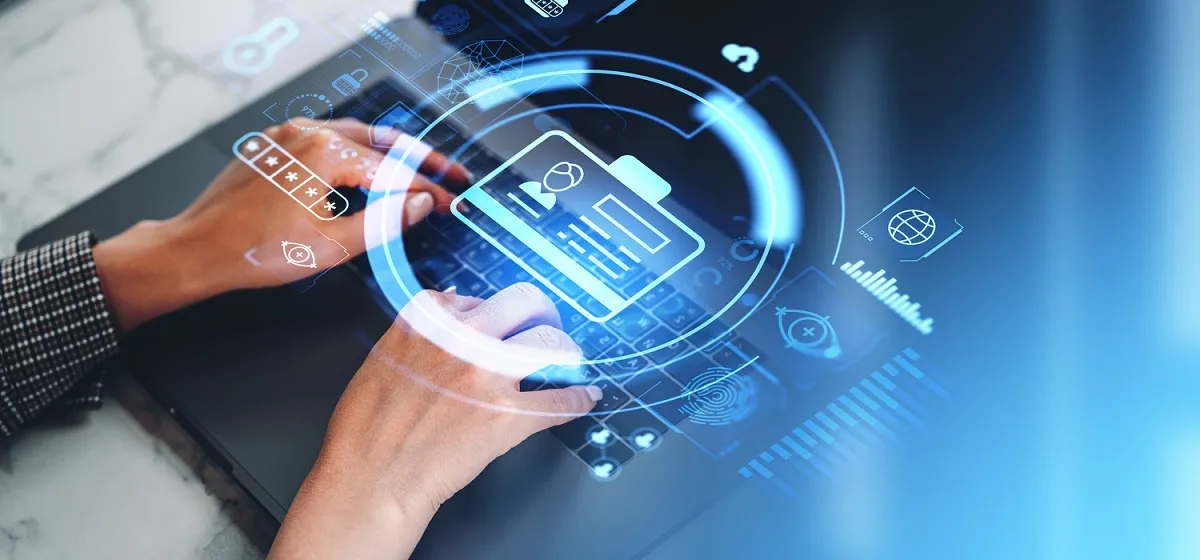 Person verifying identity on a laptop to access business systems securely.