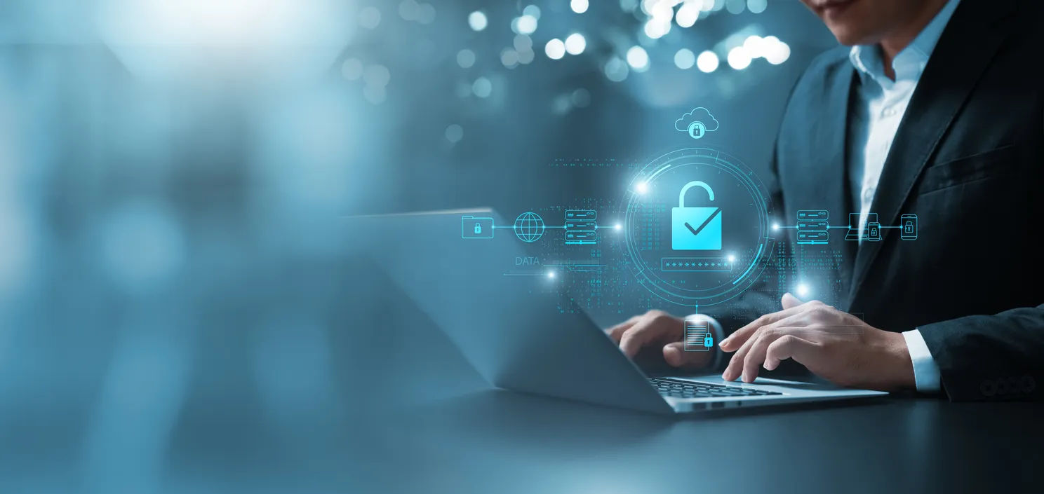 Person working securely on a laptop from a remote location connecting to office systems.