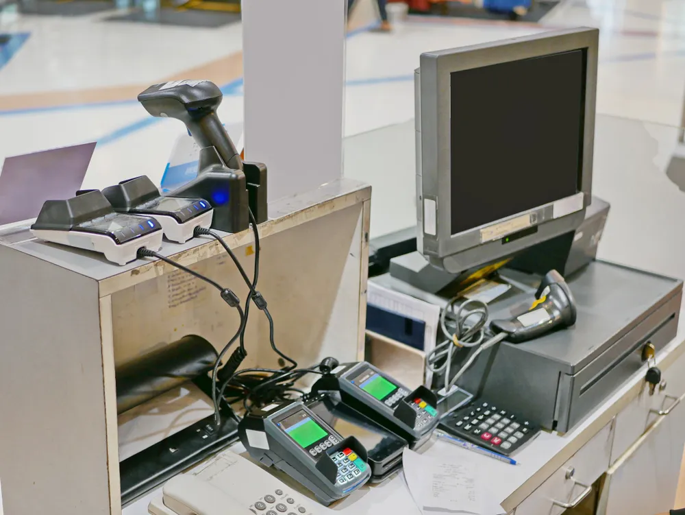 Restaurant counter with a point of sale terminal and a card payment reader